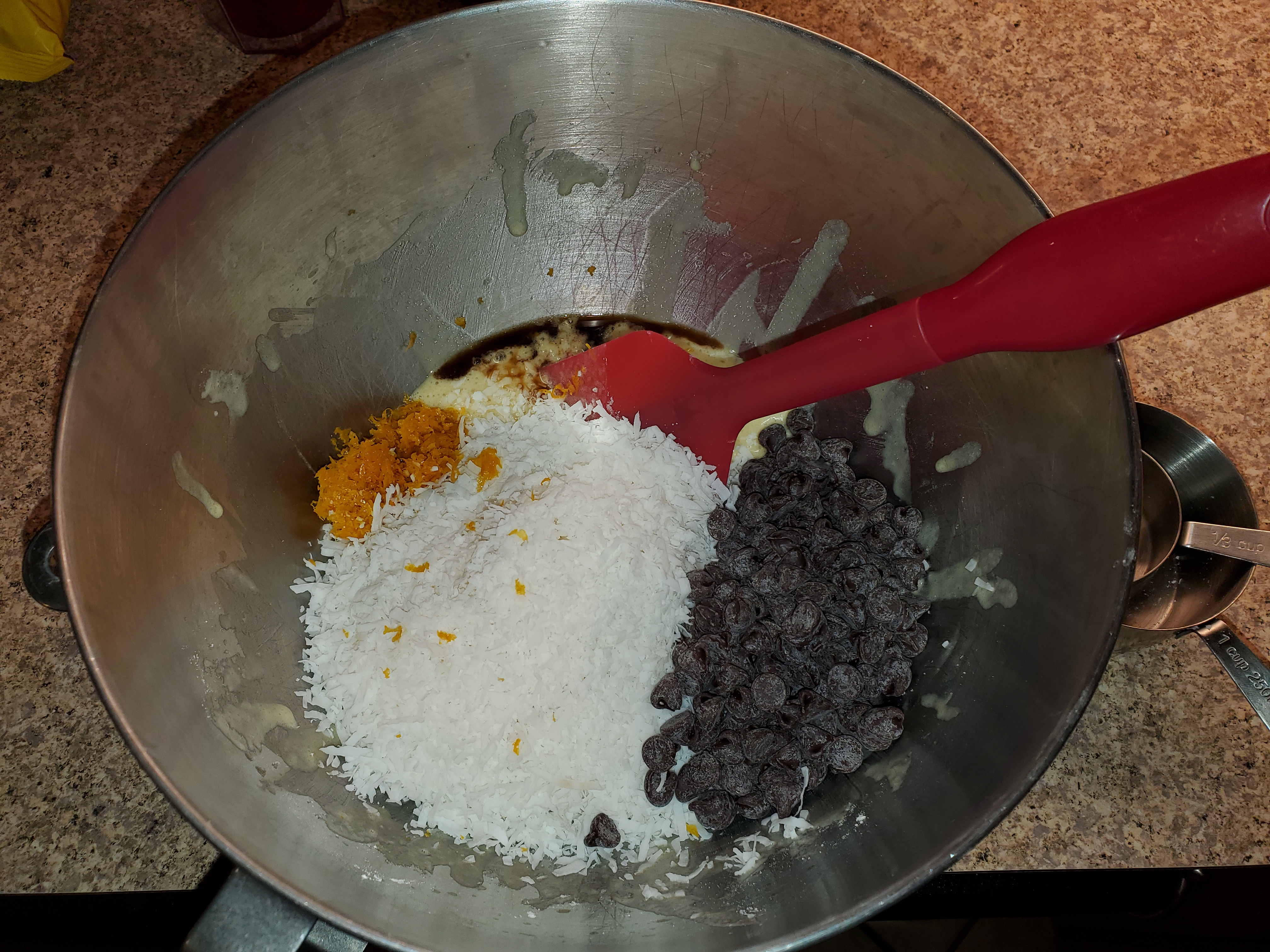 Adding Coconut, Vanilla, Chocolate Chips, and Orange Zest