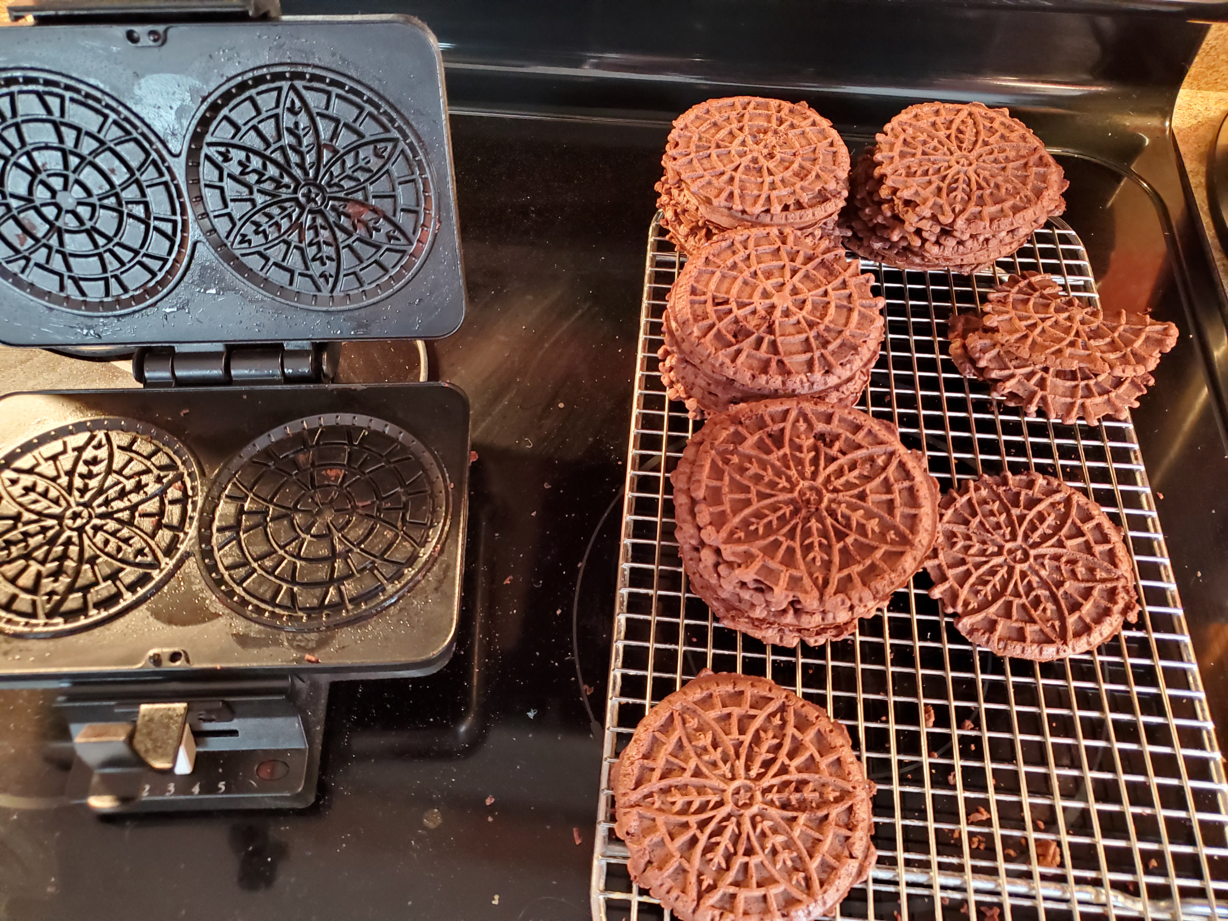 Pizzelle Iron and Finished Pizzelles on Cooling Rack